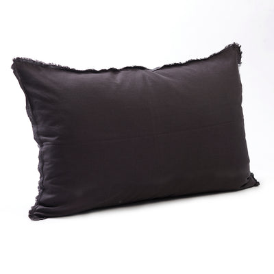 Rich dark charcoal bedhead cushion in stonewashed French flax linen, with hand-tufted edges, offering a sleek, modern look with a refined, luxurious feel.