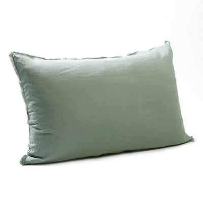 Soft sage green bedhead cushion in stonewashed French flax linen, with hand-tufted edges, offering a tranquil, earthy hue and a serene, natural vibe.