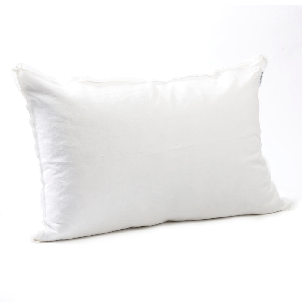 Elegant antique white bedhead cushion in stonewashed French flax linen, with hand-tufted edges, offering a soft, vintage-inspired hue and a refined, classic look.