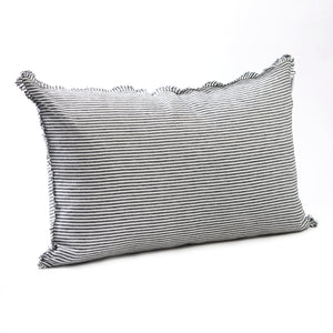 Bold dark charcoal striped bedhead cushion in stonewashed French flax linen, with hand-tufted edges, offering a sophisticated, contemporary pattern and a refined, modern touch.