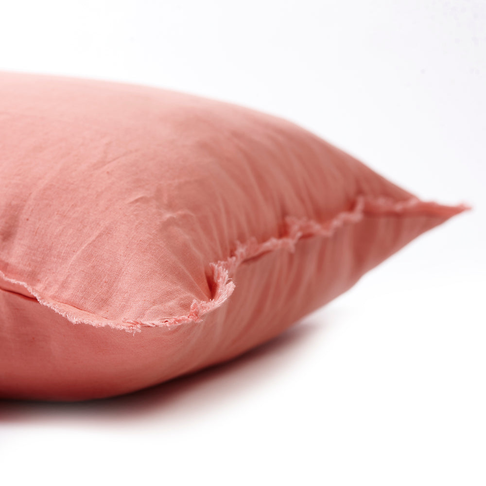 Vibrant coral bedhead cushion in stonewashed French flax linen, with hand-tufted edges for a bold, energetic pop of colour and modern charm