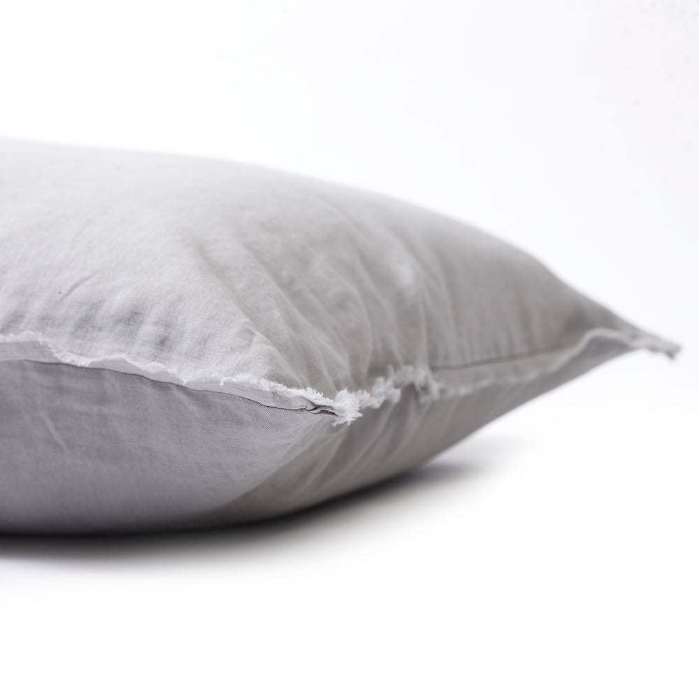 Soft dove grey bedhead cushion in stonewashed French flax linen, with hand-tufted edges for a serene, sophisticated vibe.
