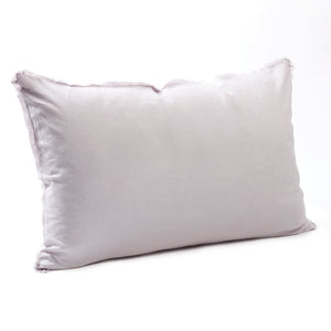 Soft lilac bedhead cushion in stonewashed French flax linen, with hand-tufted edges, offering a delicate, floral-inspired hue and a calming, elegant touch.