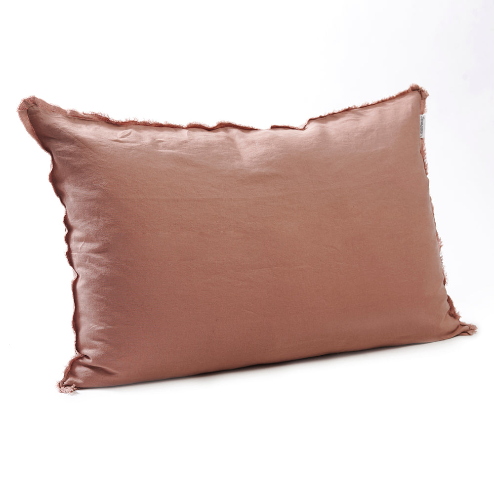 Soft lotus bedhead cushion in stonewashed French flax linen, with hand-tufted edges, offering a delicate, calming hue and a refined, peaceful look.