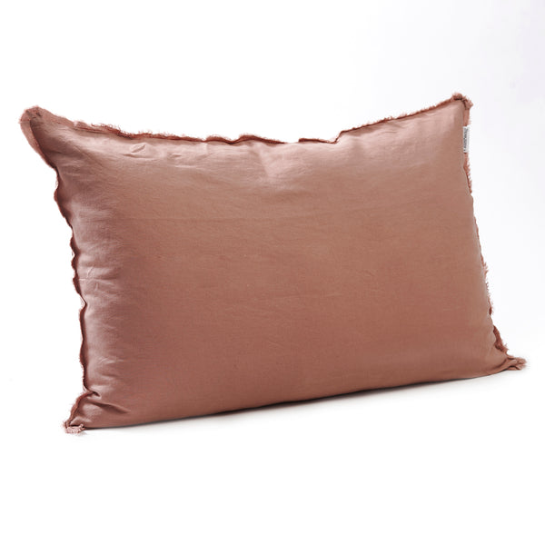 Soft lotus bedhead cushion in stonewashed French flax linen, with hand-tufted edges, offering a delicate, calming hue and a refined, peaceful look.
