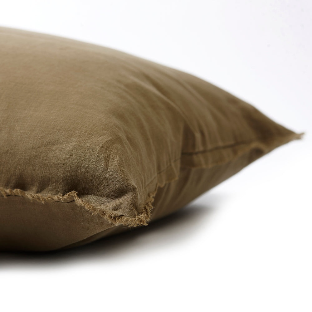 Earthy olive bedhead cushion in stonewashed French flax linen, with hand-tufted edges, offering a rich, natural hue and a relaxed, organic feel.