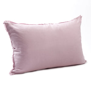 Sweet taffy bedhead cushion in stonewashed French flax linen, with hand-tufted edges and a soft, pastel charm that adds a playful touch to any space.