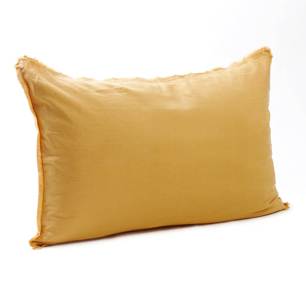 Bright sunflower yellow bedhead cushion in stonewashed French flax linen, with hand-tufted edges, bringing a cheerful, warm touch to any room.